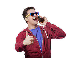 Style young man in sunglasses with mobile