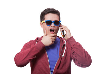 Style young man in sunglasses with mobile