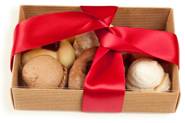 Several kinds of cookies and cakes in open box