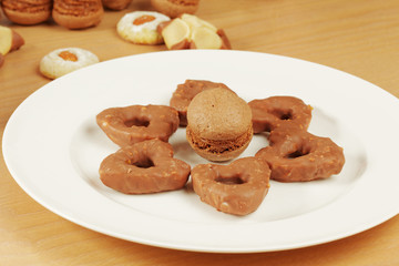 Plate on table with cookies and sponge drop lay out