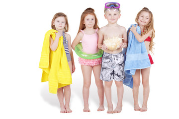 Four children, boy and three girls, in beach suits