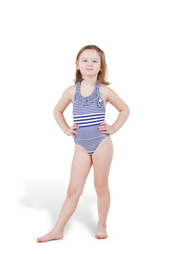 Portrait of little girl in striped swimsuit posing