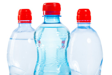 three tops of bottles of water