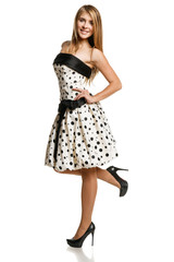 Flirty young girl in romantic dress in full length