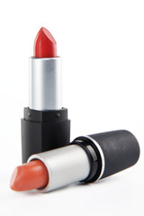 Two lipsticks on a white background