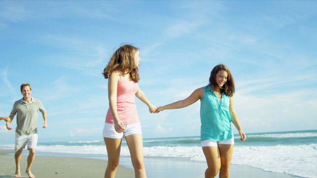 Carefree Caucasian Sisters Enjoying Beach Vacation