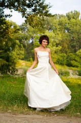 Fototapeta premium Cute little girl in a wedding dress