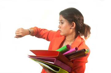 Business woman holding folders and papers is  hastily .