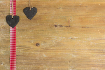 Heart of slate on a wood panel.