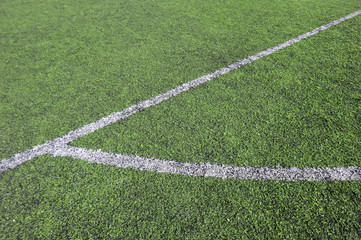 Obraz premium corner of a synthetic football field, detail