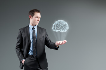 Man holding brain Hologram. Futuristic technology concept.