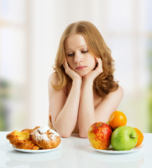 woman  choose between healthy and unhealthy food