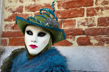 Venetian costume attends Carnival of Venice.