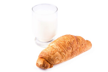 Fresh and tasty French croissant with glass of milk
