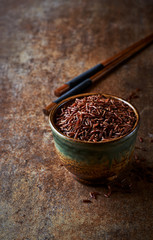 Red rice in a small ceramic dish