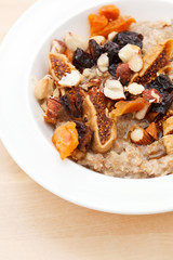 oatmeal with raisins, nuts and maple syrup