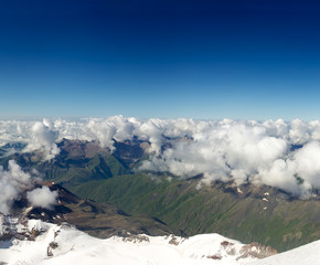 Fototapeta na wymiar Snowy mountais and clouds. Beautiful landscape