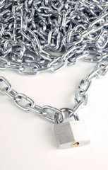 Link Chain Connected By Keyed Steel Locking Padlock on White