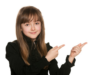 Young girl in black makes hands gesture