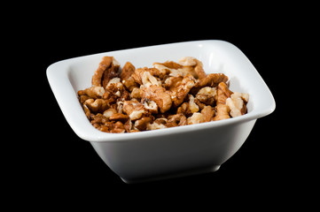 Pile of walnuts in a ceramic bowl
