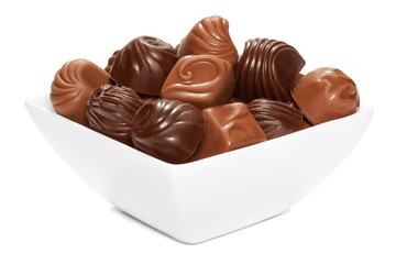 Chocolate sweets in white bowl.