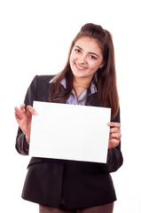 Naklejka premium Smiling young girl showing blank