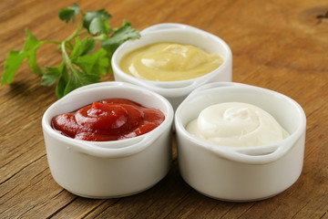 mustard, ketchup and mayonnaise - three kinds of sauces
