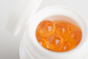 yellow transparent medicine in container