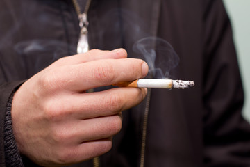 Cigarette in hand