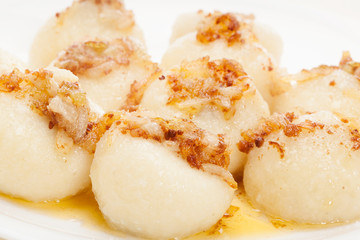 Meat stuffed dumplings with fried onion. Selective focus