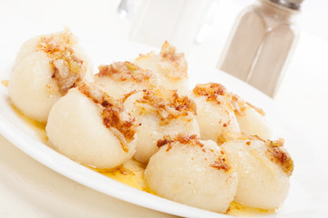 Meat stuffed dumplings with fried onion. Selective focus