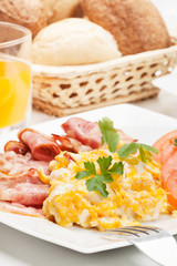 Scrambled eggs with bacon. Selective focus.