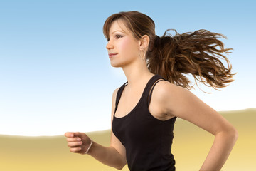 Fototapeta na wymiar Junge Frau beim Jogging vor Hintergrund