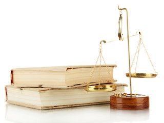 Gold scales of justice and books isolated on white