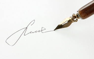 Closeup of signature (fake, not real) and ink pen, isolated
