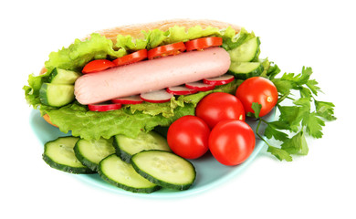 Tasty hot dog with vegetables isolated on white