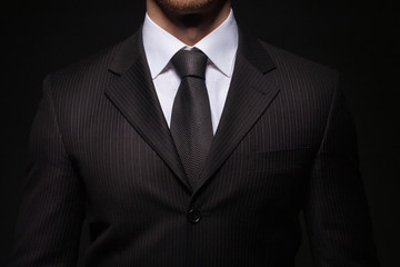 businessman standing on dark background - 50722216