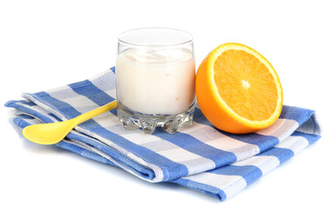 Delicious yogurt in glass with orange isolated on white