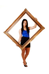 Girl holding a picture frame.