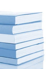 Stack of books in blue light