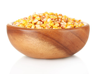 Corn in wooden bowl isolated on white