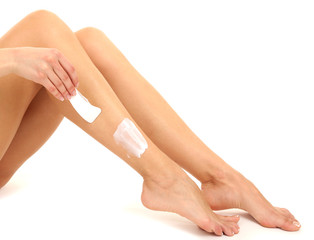 Obraz na płótnie Canvas Beautiful woman legs with depilation cream, isolated on white