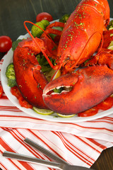 Red lobster on platter on table close-up