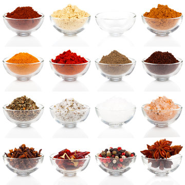 Variety of different spices in glass bowls for seasoning, isolat