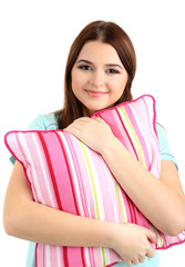 Beautiful young girl with pillow isolated on white.