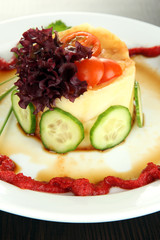 Small portion of food on big plate close up