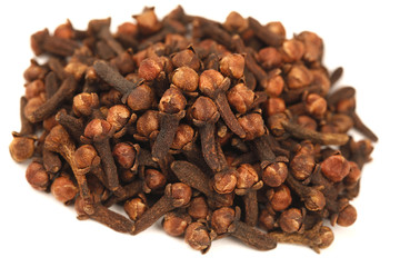 Cloves Scattered on White Background