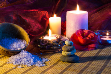 four candles camellias stones and salt
