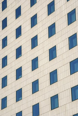 Modern public building wall,  blue windows as background