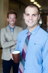 portrait of two young handsome businessmen